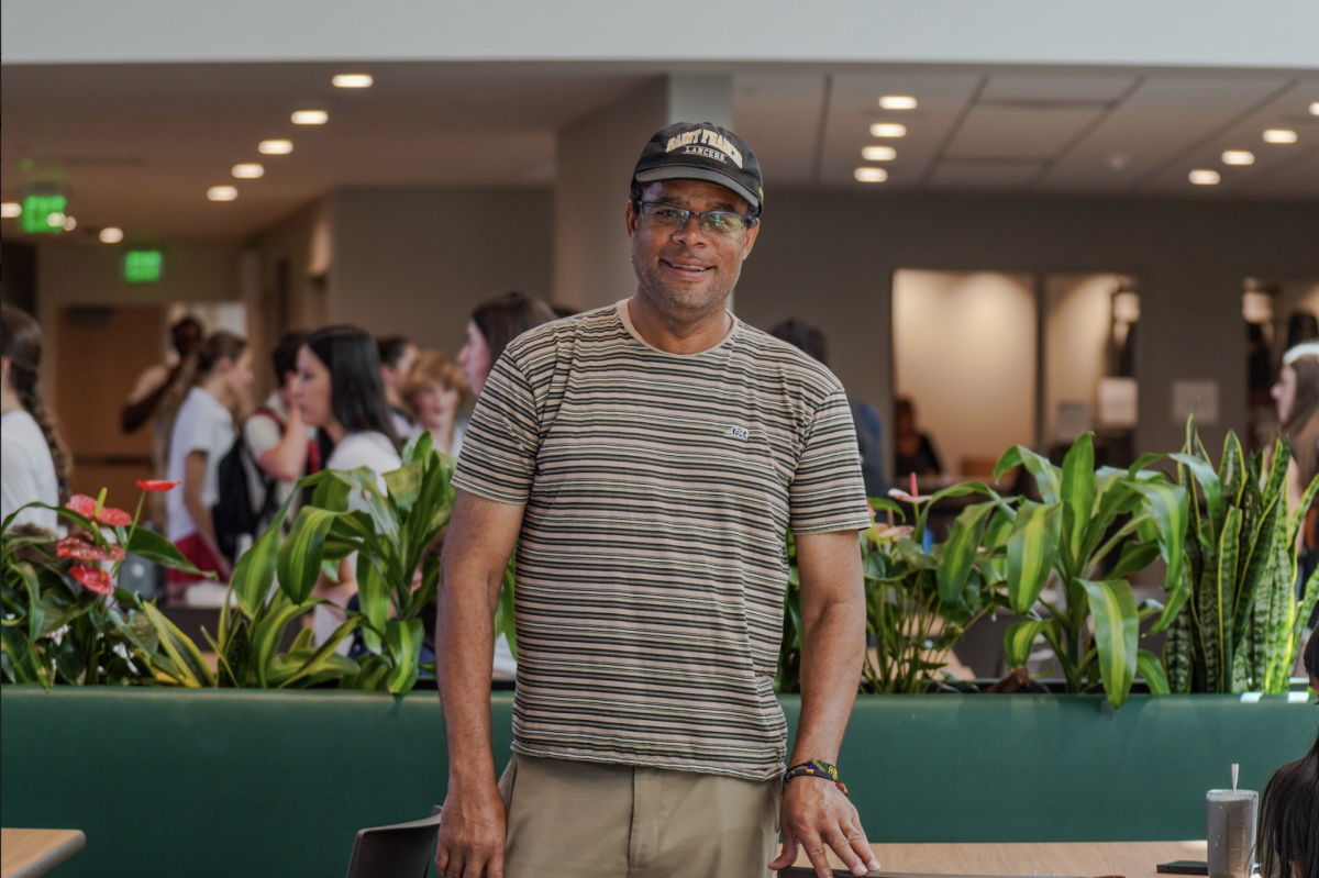 Hospitality Manager Winston Wint poses in the new Dining Commons.